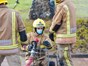 Firefighter operating hose