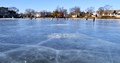 People playing on frozen lake