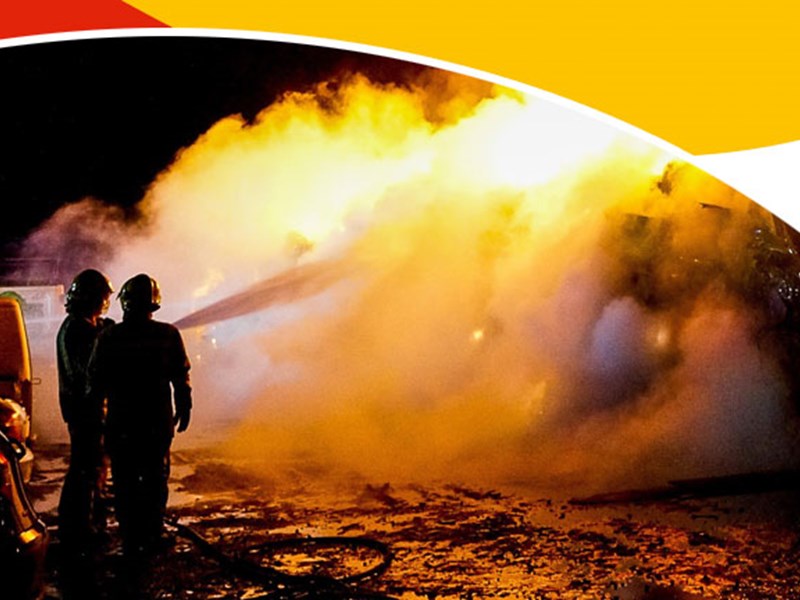 Firefighters hosing down fire
