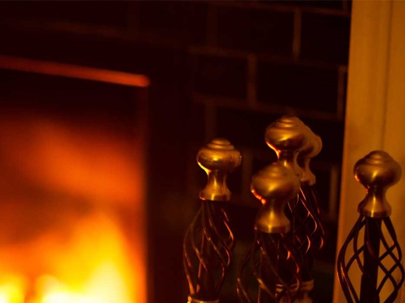Lit fire under a chimney
