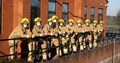 Firefighters lined up wearing masks