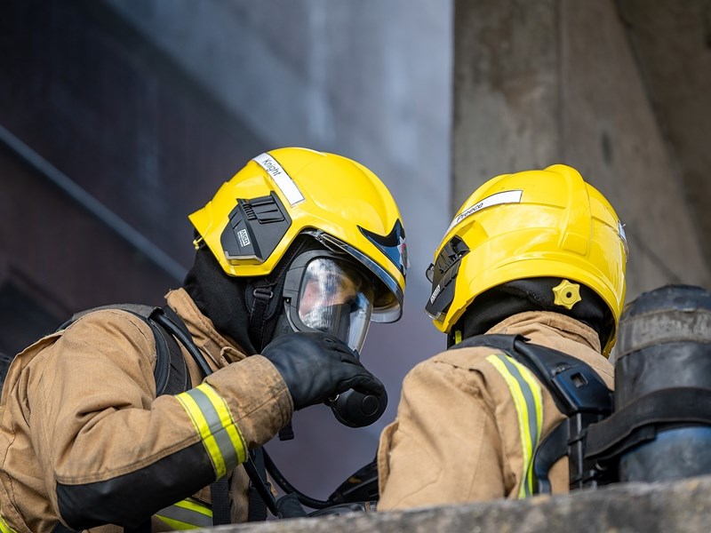 Two firefighters talking