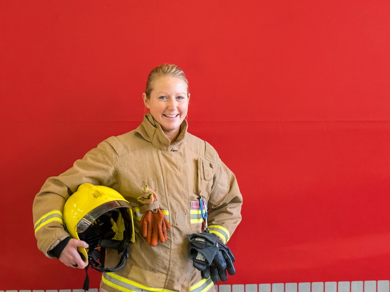 Female firefighter smiling