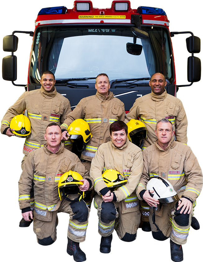 Fire fighters knelt infront of a fire truck