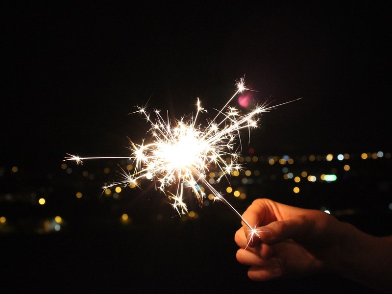 child holding sparkler
