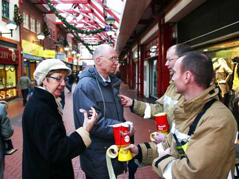 Two firefighters raising money for the Firefighters Charity