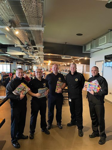 Firefighters giving out gifts at the Christmas dinner at Vale Park