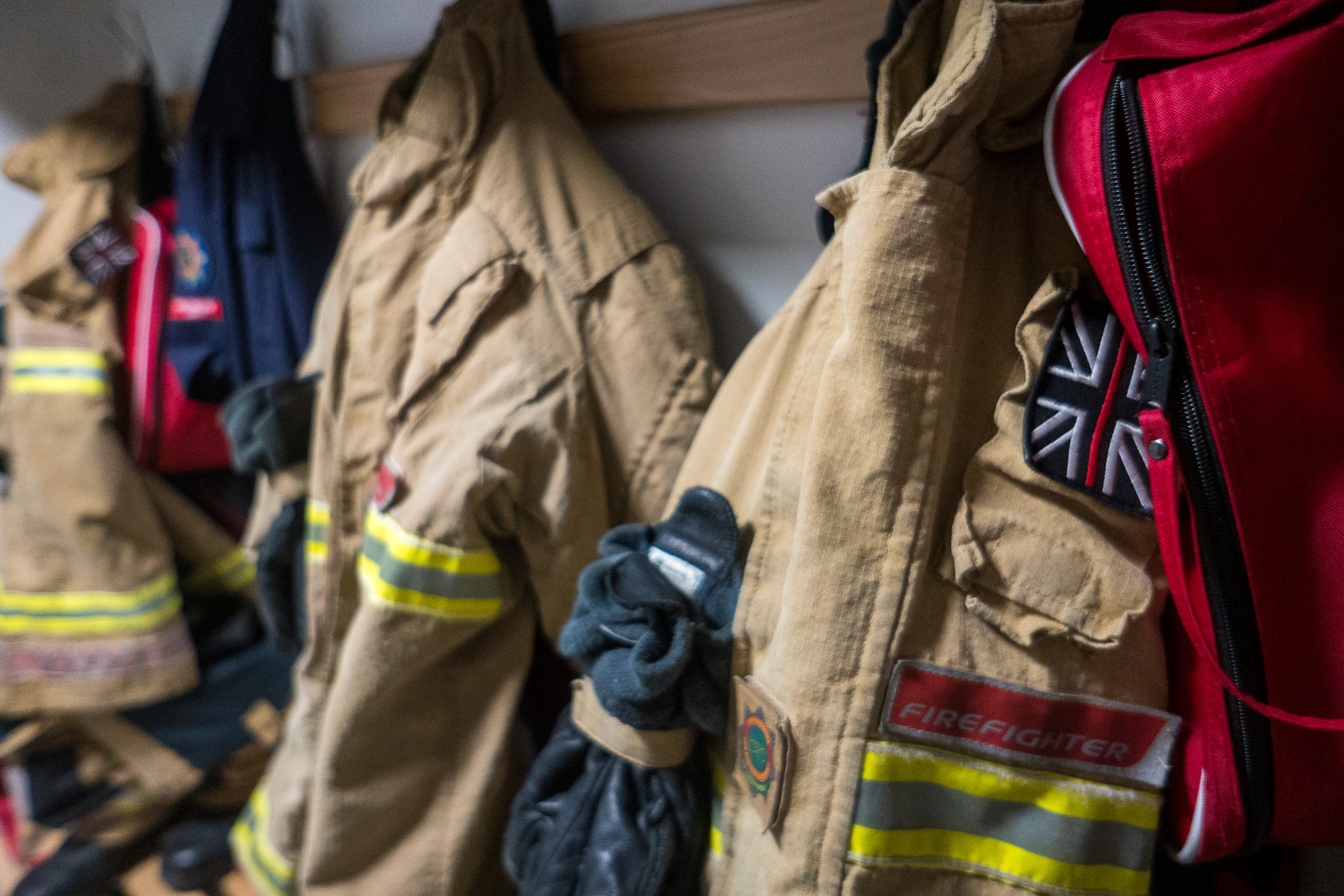 Uniforms hung up on pegs